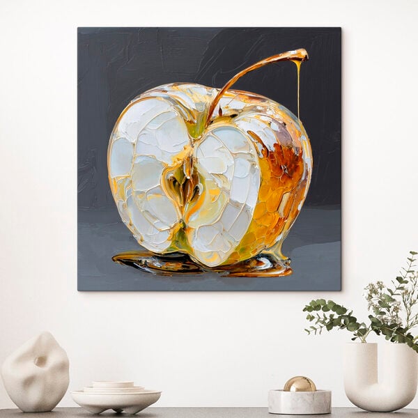 Transparent apple with golden drips
